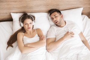 woman unhappy with snoring partner